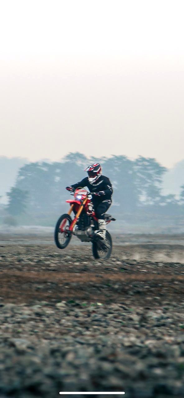 Leon Lhendup Wangdi airborne on his rally motorcycle